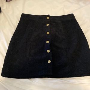 Black skirt with gold buttons